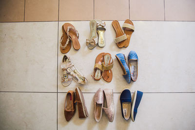 High angle view of shoes on tiled floor