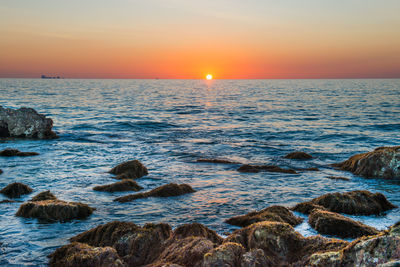 Scenic view of sea against sky during sunset