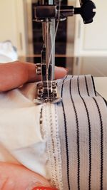 Close-up of woman working on fabric