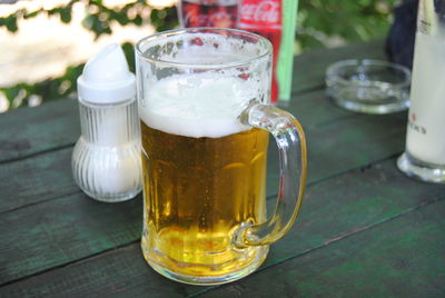 Close-up of beer glass on table