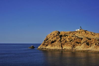 Scenic view of sea against clear blue sky