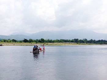 View of lake against cloudy sky