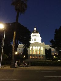 View of illuminated street lights at night