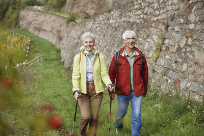 Germany, rheingau, happy senior couple hiking together