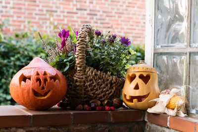 Close-up of pumpkin on stone wall during halloween