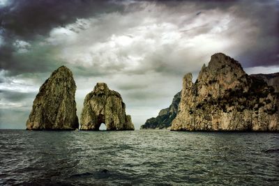 Scenic view of sea against cloudy sky