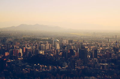 Aerial view of city against sky