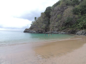 Scenic view of beach and sea against sky