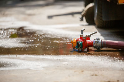 Close-up of hose pipe on wet floor