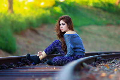 Portrait of woman sitting outdoors