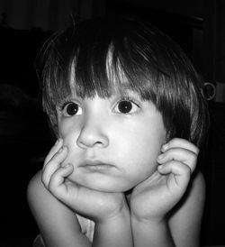 Close-up of cute boy looking away