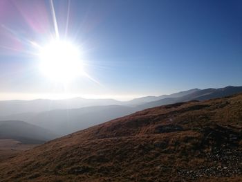 Sun shining over landscape