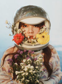 Portrait of woman with flowers