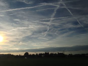 Scenic view of landscape against cloudy sky