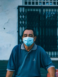 Portrait of young man standing outdoors