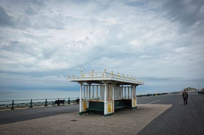 Lifeguard hut on beach against sky