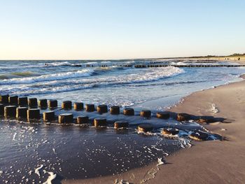 Scenic view of beach against clear sky