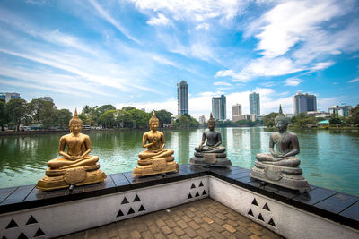 View of cityscape against cloudy sky