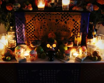 Close-up of illuminated lighting equipment on table