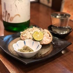 Close-up of japanese sake served on table