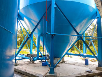 Metallic structure in playground against blue sky