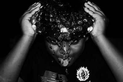 Close-up portrait of a girl holding flower head