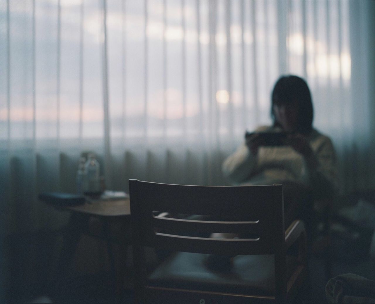 seat, chair, sitting, indoors, real people, one person, table, adult, window, business, office, focus on foreground, women, lifestyles, selective focus, glass - material, day, corporate business