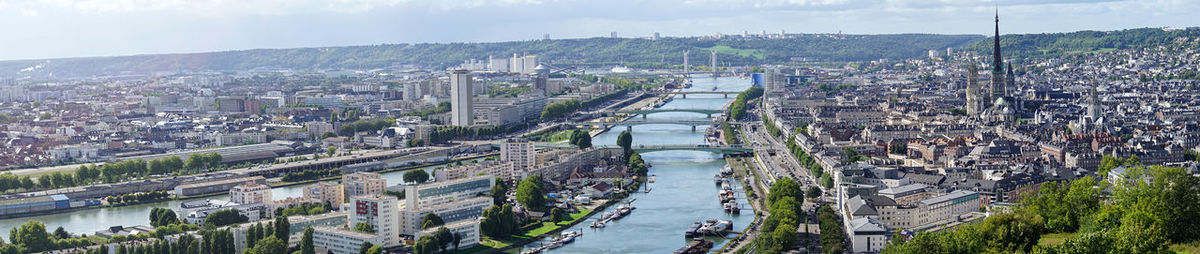 High angle view of bridge over river amidst buildings in city