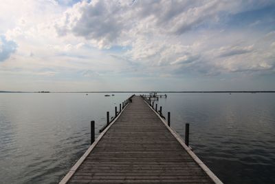 Pier over sea against sky