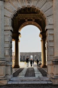 People walking in historical building