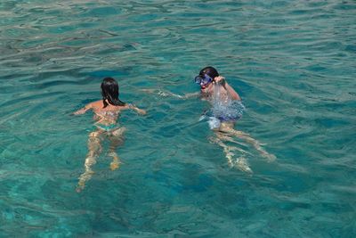 People swimming in water