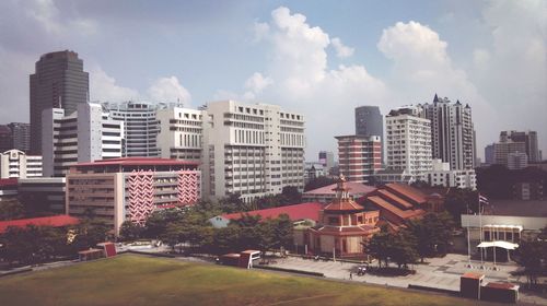 Buildings in city against sky