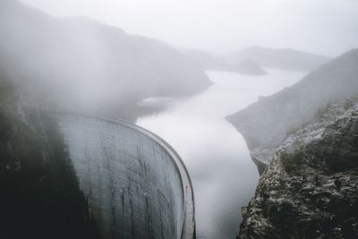 Scenic view of the dam in foggy weather. 