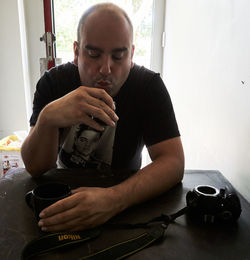 Man sitting on table at home