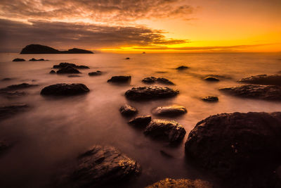 Scenic view of sea at sunset