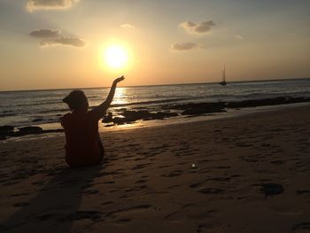 People on beach at sunset