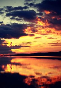 Scenic view of calm lake at sunset