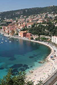 High angle view of buildings by sea