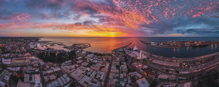 High angle view of buildings against sky during sunset