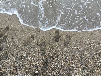 High angle view of waves on beach