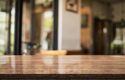 Close-up of empty wooden table in restaurant