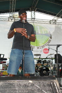 Low angle view of man singing in concert at stage