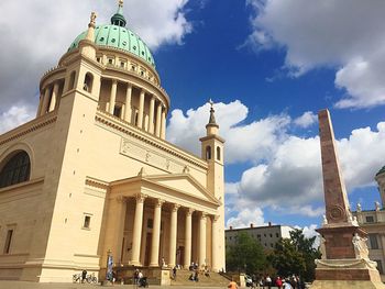 Low angle view of cathedral against cloudy sky