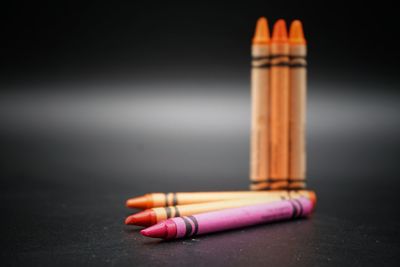 Close-up of colored pencils on table