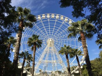 Low angle view of ferris wheel against sky