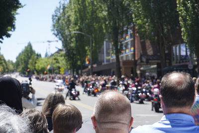 Crowd on city street during military parade