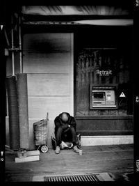 Man sitting on wall