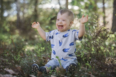 Portrait of smiling boy on field