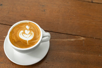 High angle view of cappuccino on table