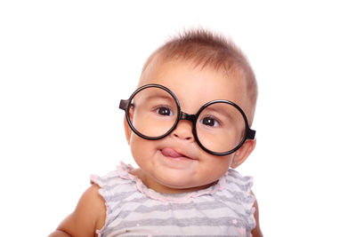 Portrait of man wearing eyeglasses against white background